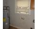 The utility room features a water heater, a window, and hookups for a washer and dryer at 3628 Michigan Ave, Charlotte, NC 28215