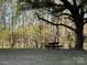 Spacious backyard featuring a picnic table underneath a large tree for enjoying the outdoors at 3694 Nc Highway 109 S Hwy, Mount Gilead, NC 27306