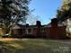Charming single-story brick home with chimneys and mature trees in a spacious yard at 3694 Nc Highway 109 S Hwy, Mount Gilead, NC 27306