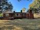 Charming single-story brick home featuring a classic design and inviting front porch at 3694 Nc Highway 109 S Hwy, Mount Gilead, NC 27306