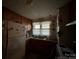 Vintage kitchen features a double sink, updated countertops, and window with curtains at 3694 Nc Highway 109 S Hwy, Mount Gilead, NC 27306