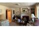 Spacious living room with classic fireplace, carpet flooring, and ample natural light at 3694 Nc Highway 109 S Hwy, Mount Gilead, NC 27306