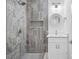 Updated bathroom features tiled shower with niche, and modern vanity at 3717 Marvin Rd, Charlotte, NC 28211