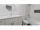 A clean bathroom featuring a soaking tub, white vanity, and decorative mirror at 3717 Marvin Rd, Charlotte, NC 28211