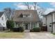 Charming home featuring a well-manicured front yard, inviting entrance, and craftsman architecture at 412 Frazier Ave, Charlotte, NC 28216