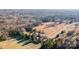 Aerial view showcases the expansive wooded surroundings and the home's serene location at 445 Cannon Farm Rd, China Grove, NC 28023