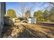 View of backyard with shed, carport, and stairs to the back door at 445 Cannon Farm Rd, China Grove, NC 28023