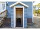 Basement access with brick foundation and door provides secure entry at 445 Cannon Farm Rd, China Grove, NC 28023
