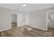 Bedroom with newly installed floors and adjacent bathroom access at 445 Cannon Farm Rd, China Grove, NC 28023