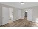 Bedroom with an adjoining bathroom and closet with new floors at 445 Cannon Farm Rd, China Grove, NC 28023