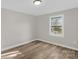 Bedroom featuring new flooring, a window, and a fresh coat of neutral paint at 445 Cannon Farm Rd, China Grove, NC 28023