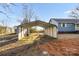 Exterior shot of the carport adjacent to the house and shed in the backyard of the home at 445 Cannon Farm Rd, China Grove, NC 28023
