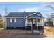 Charming one-story home with blue siding, white trim, and a welcoming front porch at 445 Cannon Farm Rd, China Grove, NC 28023