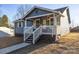 Charming front porch with white railings and a clear view of the home's entrance at 445 Cannon Farm Rd, China Grove, NC 28023