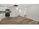 Bright kitchen showcasing new appliances, cabinets, and hardwood floors at 445 Cannon Farm Rd, China Grove, NC 28023