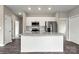 Modern kitchen featuring white cabinets, stainless steel appliances, and a granite-topped center island at 451 Geroid St, Salisbury, NC 28144