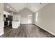 Open-concept living space featuring modern gray floors, recessed lighting, and a vaulted ceiling at 451 Geroid St, Salisbury, NC 28144