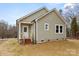 Side view of charming home showcasing the siding, windows, and landscaped yard at 451 Geroid St, Salisbury, NC 28144