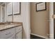 Bathroom boasts a granite countertop vanity and dark flooring, offering style and practicality at 5009 Sharon Rd # E, Charlotte, NC 28210