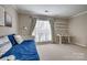 Bedroom featuring a daybed, window and desk area, offering versatility and functionality at 5009 Sharon Rd # E, Charlotte, NC 28210
