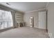 Spacious bedroom with ample light, shelves, a desk area, and neutral carpeting at 5009 Sharon Rd # E, Charlotte, NC 28210