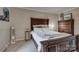 Well-lit bedroom with a large bed, decorative furniture, and a tranquil atmosphere at 5009 Sharon Rd # E, Charlotte, NC 28210
