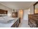 Spacious bedroom featuring a comfortable bed and two dressers, offering ample storage space at 5009 Sharon Rd # E, Charlotte, NC 28210
