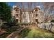 Charming apartment building with well-maintained landscaping and a sidewalk leading to the entrances at 5009 Sharon Rd # E, Charlotte, NC 28210