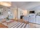 An open concept dining room leads into the home's living room area at 5009 Sharon Rd # E, Charlotte, NC 28210