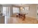 Dining room with wood bench seating, an overhead light, and a view of the outdoor patio at 5009 Sharon Rd # E, Charlotte, NC 28210