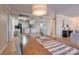 An open concept dining room features wood table with an eat-in kitchen view, perfect for hosting guests at 5009 Sharon Rd # E, Charlotte, NC 28210