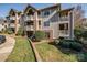 Multi-level condo with brick accents, balconies, and well-maintained landscaping at 5009 Sharon Rd # E, Charlotte, NC 28210