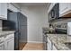 This kitchen features ample counter space, a black refrigerator, and updated appliances at 5009 Sharon Rd # E, Charlotte, NC 28210