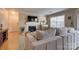 Cozy living room featuring a fireplace, comfortable seating, and bright natural light from a large window at 5009 Sharon Rd # E, Charlotte, NC 28210