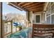 Relaxing covered patio with wooden furniture, a blue bench, rug and natural light for outdoor enjoyment at 5009 Sharon Rd # E, Charlotte, NC 28210