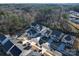 Aerial view of homes in a quiet neighborhood backing up to a mature wooded area at 5028 Colline Ct, Charlotte, NC 28216