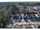Aerial view of the homes in the neighborhood surrounded by mature trees in a private community at 5028 Colline Ct, Charlotte, NC 28216