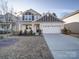 Exterior shot of a home with a well-maintained lawn, neutral siding, and welcoming front porch at 5028 Colline Ct, Charlotte, NC 28216