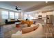 Open-concept living area seamlessly connects the kitchen and dining spaces for modern living at 5028 Colline Ct, Charlotte, NC 28216