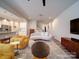 Bright, open living room featuring modern decor, stylish furniture, and neutral tones at 5028 Colline Ct, Charlotte, NC 28216