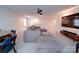 Expansive living room featuring plush sectional seating and modern media center at 5028 Colline Ct, Charlotte, NC 28216