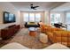 Bright and airy living room featuring a large TV, modern furniture, and lots of seating at 5028 Colline Ct, Charlotte, NC 28216