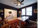 Office area with desk and wood accents, featuring two windows letting in lots of light at 5028 Colline Ct, Charlotte, NC 28216