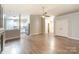 Open concept living space with fresh paint and hardwood floors, next to the kitchen at 6025 Raisin Tree Ln, Charlotte, NC 28215