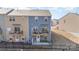 A view of the back of the townhome with a small balcony and patio area fenced in at 6503 Revolutionary Trl, Charlotte, NC 28217