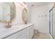 Bright bathroom features double vanity with modern fixtures and walk-in shower at 6503 Revolutionary Trl, Charlotte, NC 28217