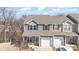 Charming two-story townhome with stone accents and attached one car garage at 6503 Revolutionary Trl, Charlotte, NC 28217