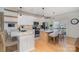Modern kitchen features white cabinets, stainless steel appliances, and granite countertops at 6503 Revolutionary Trl, Charlotte, NC 28217