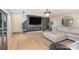 A spacious living room with hardwood floors and a modern electric fireplace at 6503 Revolutionary Trl, Charlotte, NC 28217