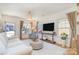 Bright living room with white walls, neutral furniture, hardwood floors and large windows at 6503 Revolutionary Trl, Charlotte, NC 28217